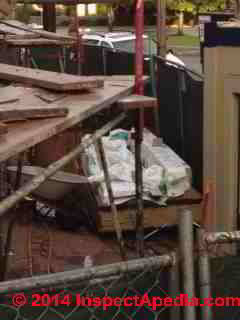 Brand X Fiber Cement Siding being installed soaking wet in wet weather (C) InspectApedia.com E.D. 