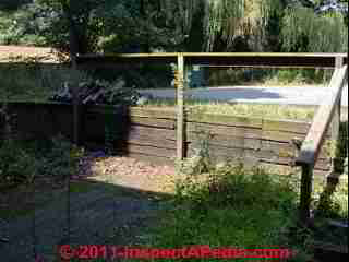 Wooden landscape tie retaining wall © D Friedman at InspectApedia.com 