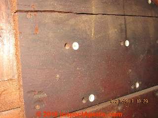 Roof sheathing using perforated boards sporting ceramic bushings (C) InspectApedia.com David Grudzinski