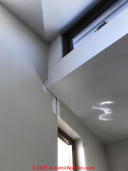 Drywal cracks at cantilever and window (C) InspectApedia.com Sherman B