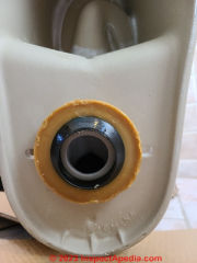 Toilet wax ring seal now in place on the toilet base (C) Daniel Friedman at InspectApedia.com