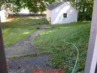 Photograph of a clogged, broken clay drain line pipe section after excavation.