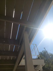Unsafe high deck post, possible collapse risk (C) InspectApedia.com SPerry