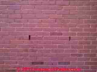 Cracks in brick veneer wall © Daniel Friedman at InspectApedia.com